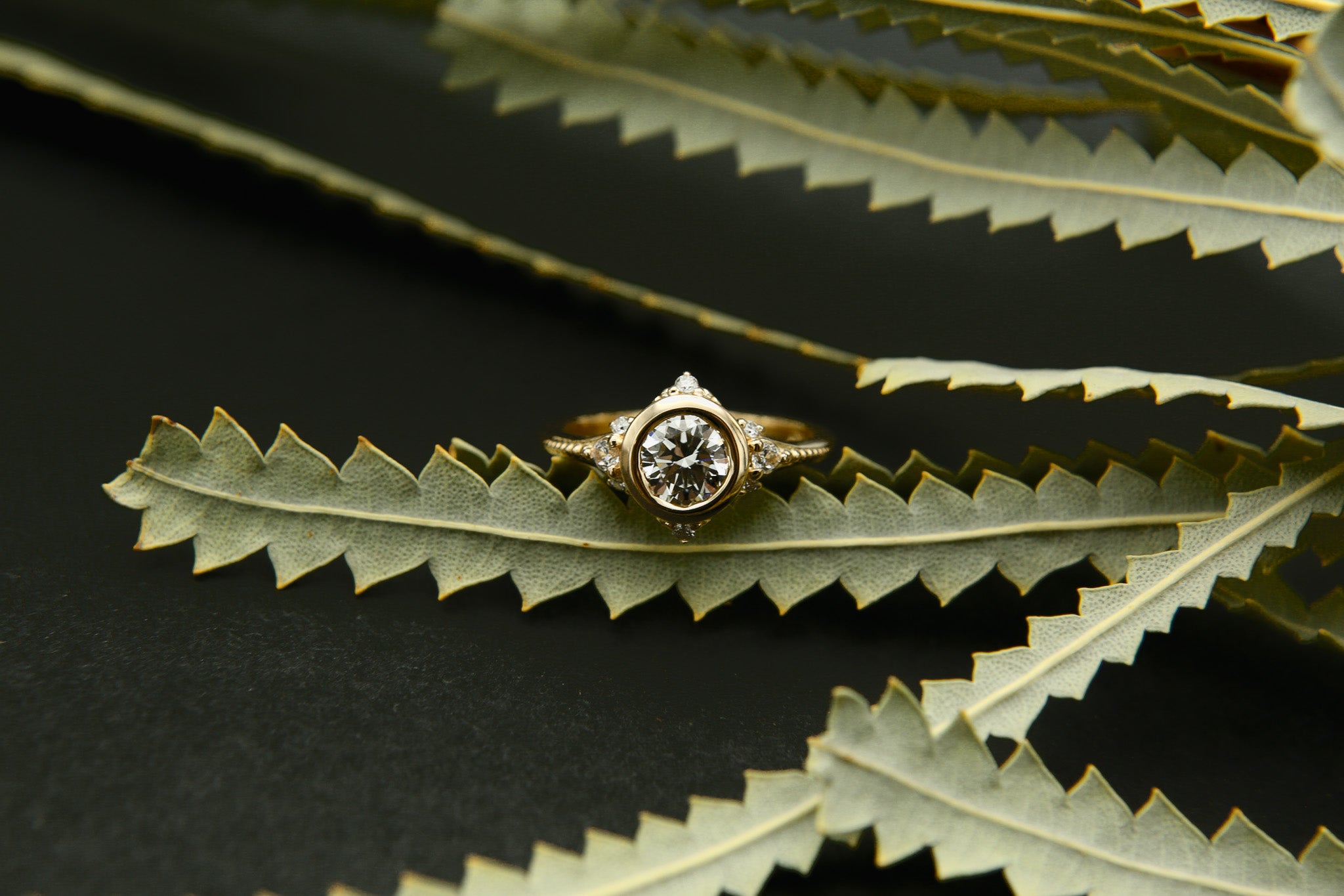 Round brilliant diamond engagement ring with tiny diamond accents - Cival Jewelry Milwaukee