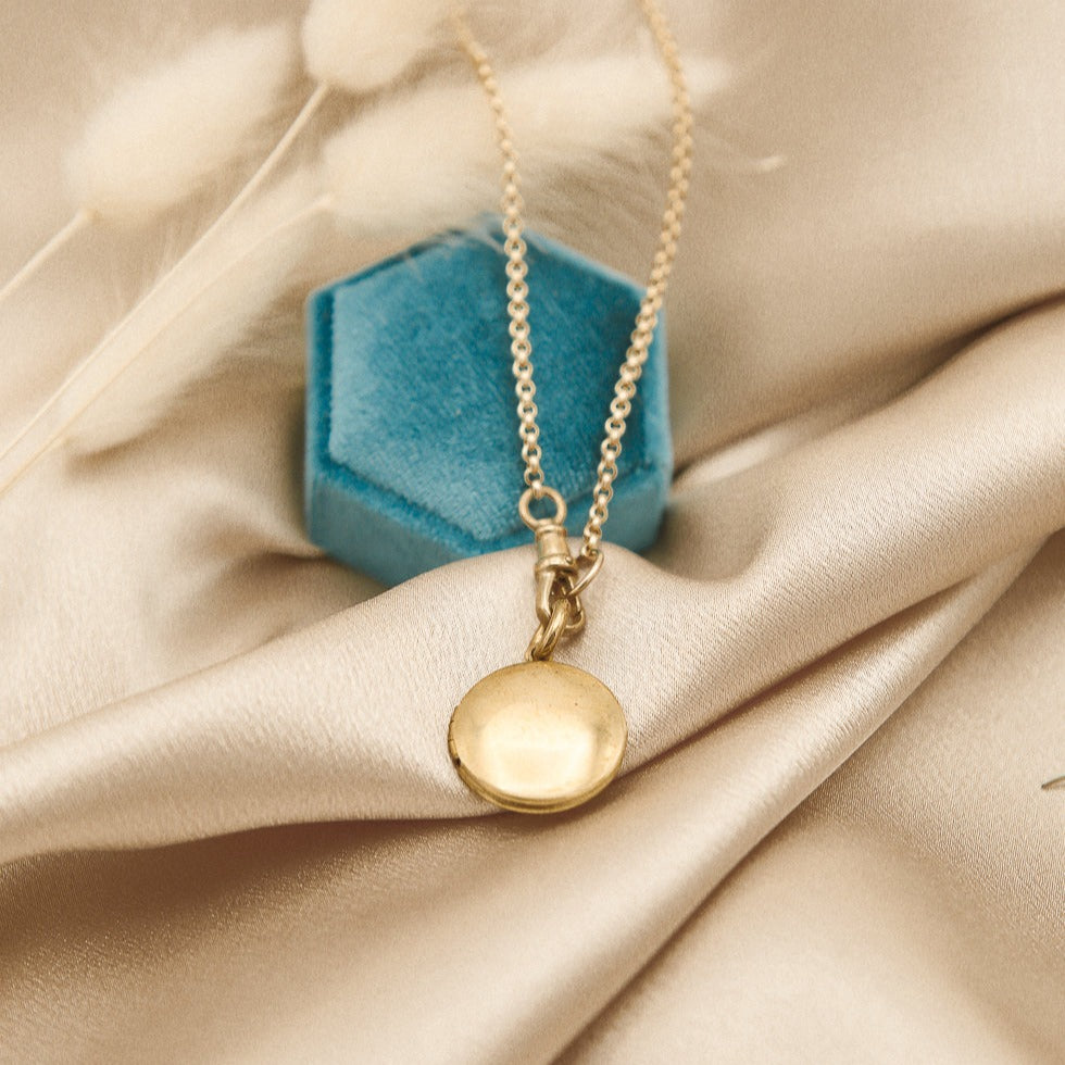 Round brass vintage locket on a gold fill chain with a brass swivel clasp - Cival Jewelry Milwaukee