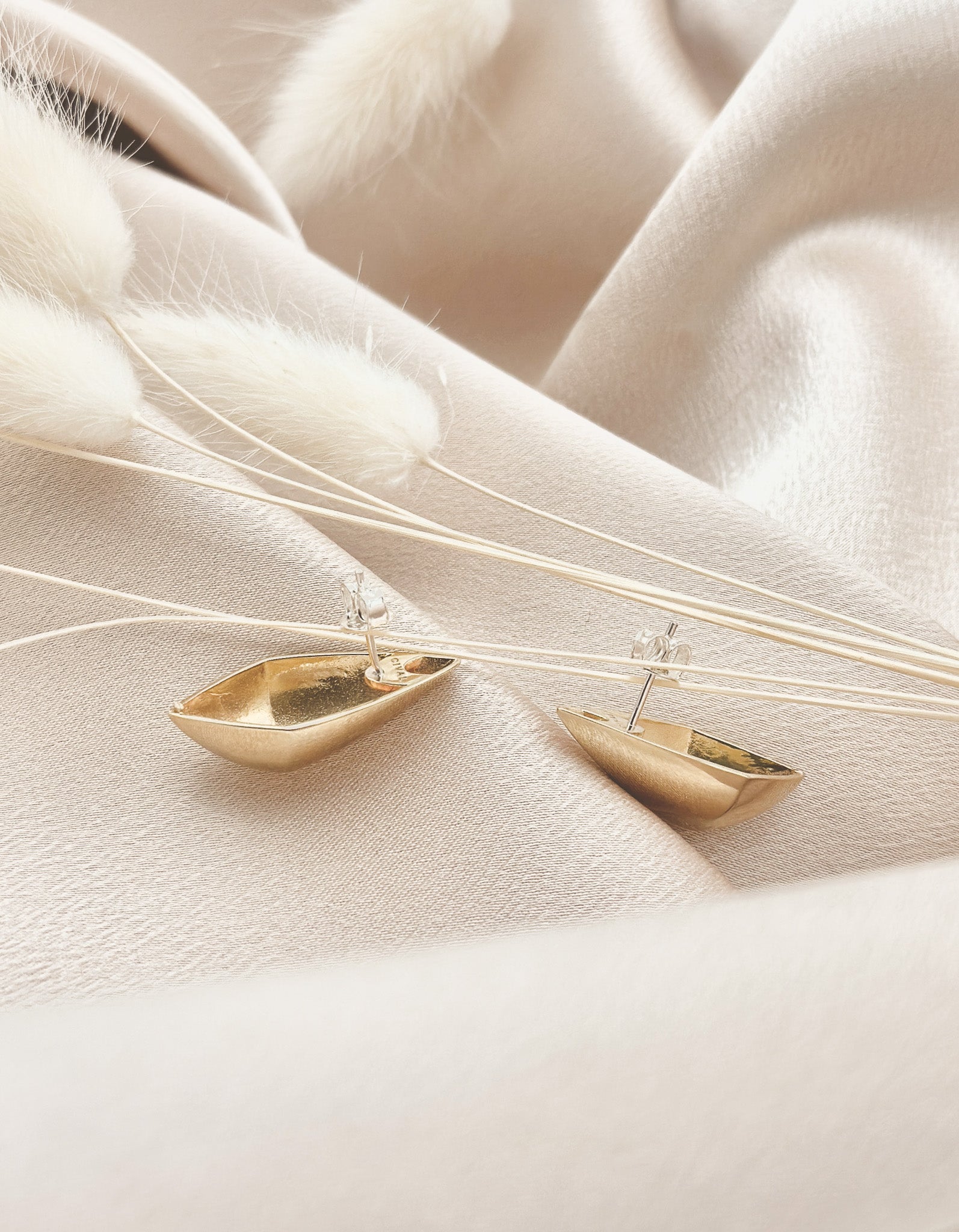 High polish sliver or brass angular talon posts are a Cival original design made with sterling silver backs