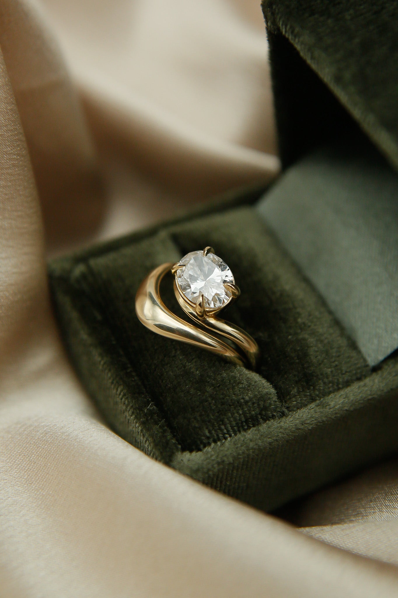 Gold wave ring with east west oval Dimond engagement ring by cival collective - Milwaukee Jewelry company
