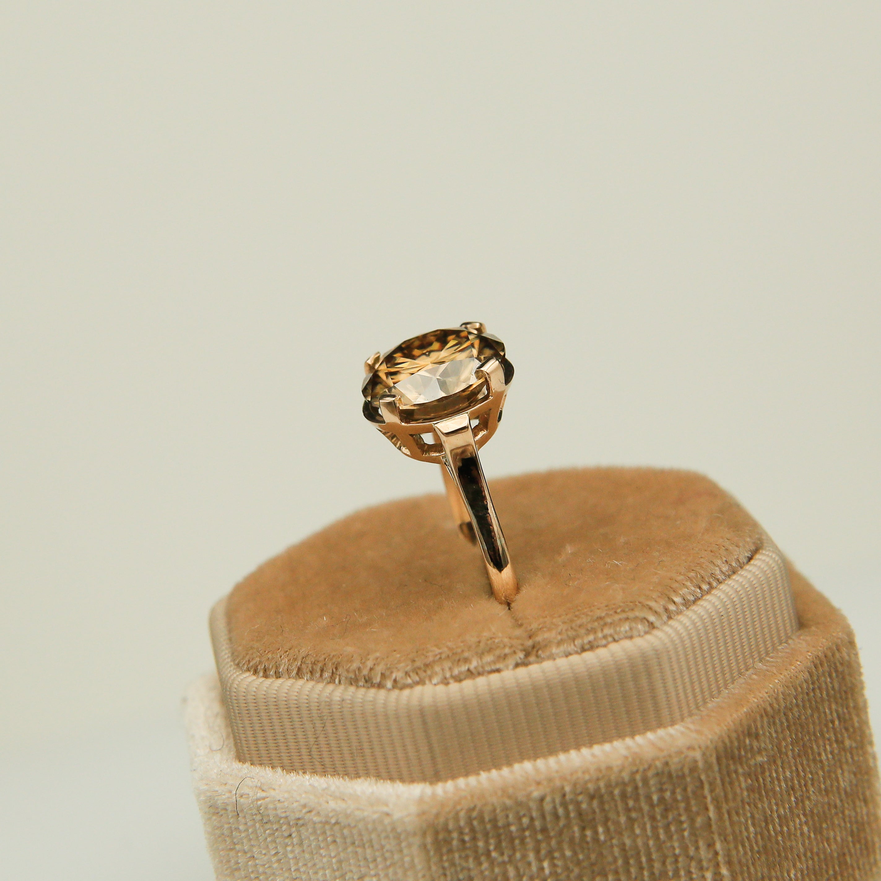 side view of 5ct pink champagne moissanite ring with gold band
