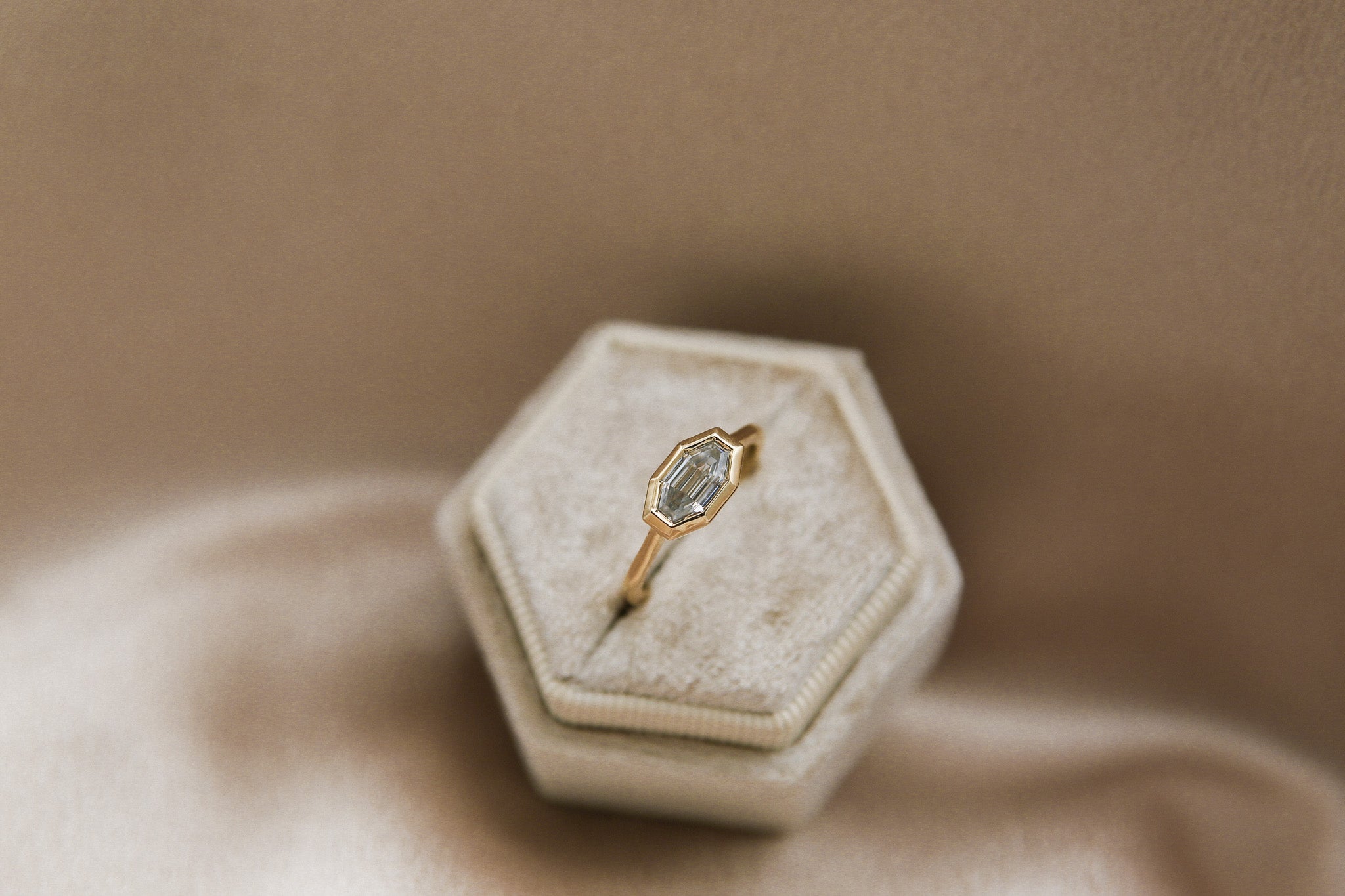 Yellow gold east west step cut gray moissanite engagement ring in vintage velvet box by cival