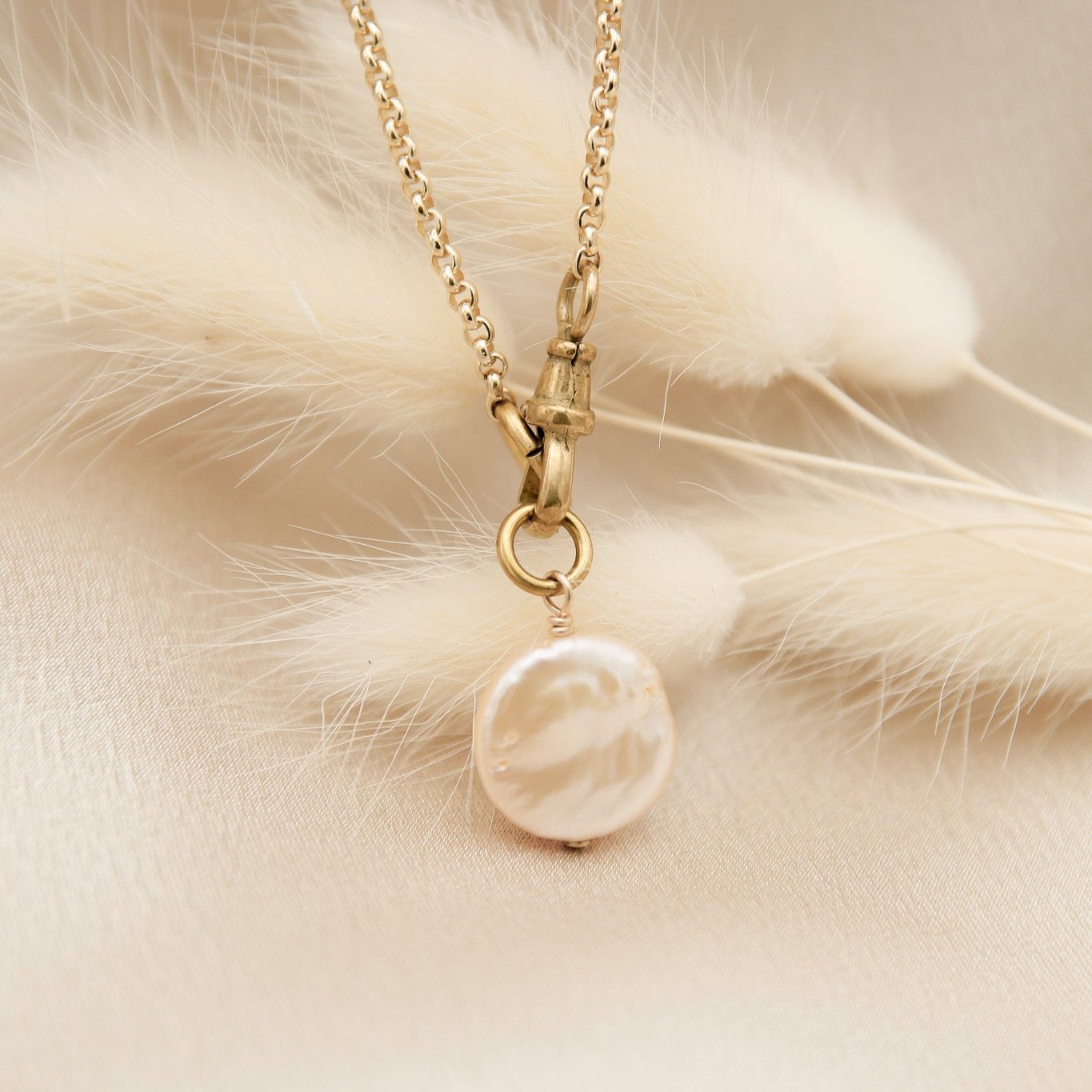 Coin pearl necklace on a gold fill chain with pocket watch clasp