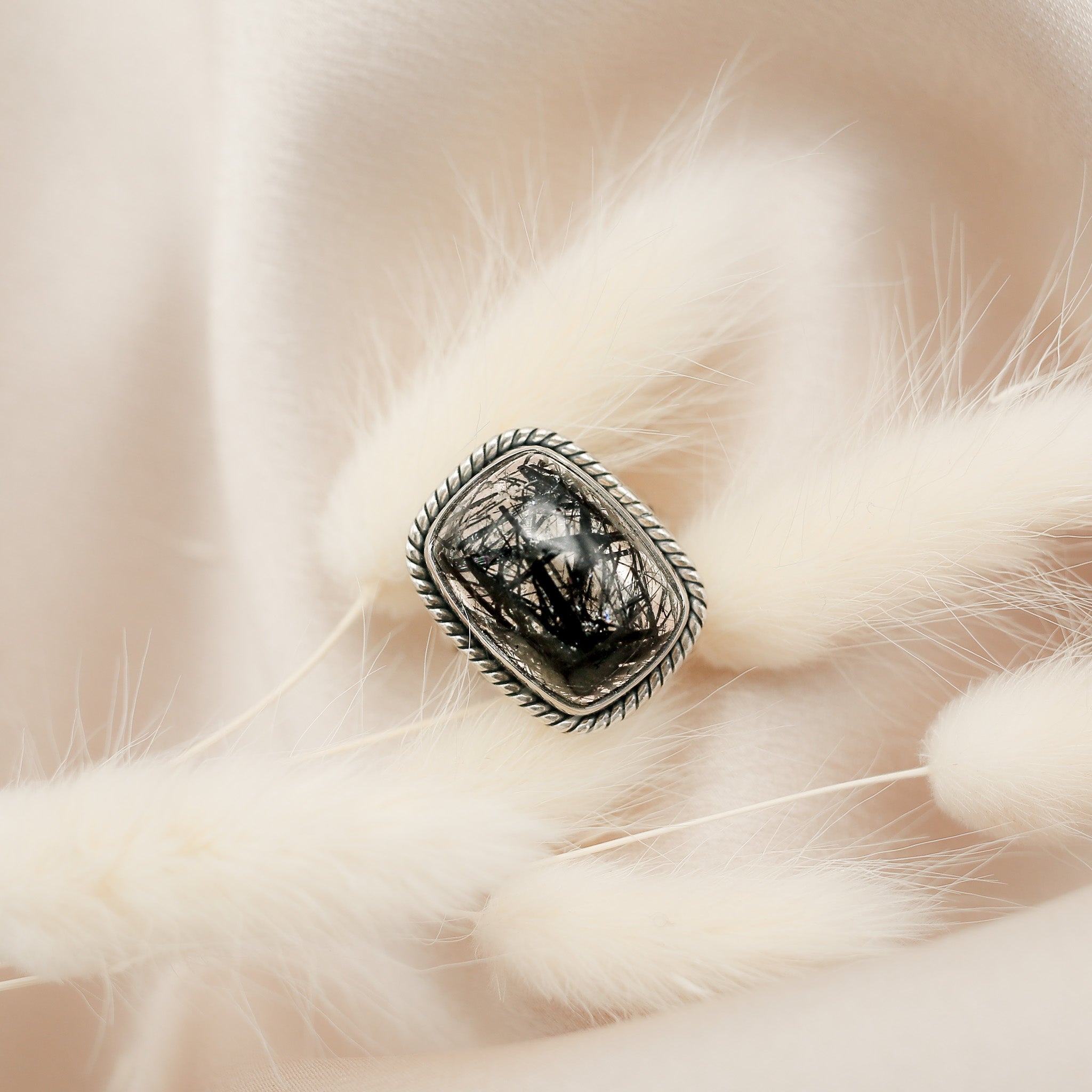 BLack tourmaline in clear quartz rectangle cabochon ring with twisted silver bezel by local Milwaukee jewelry store Cival Collective