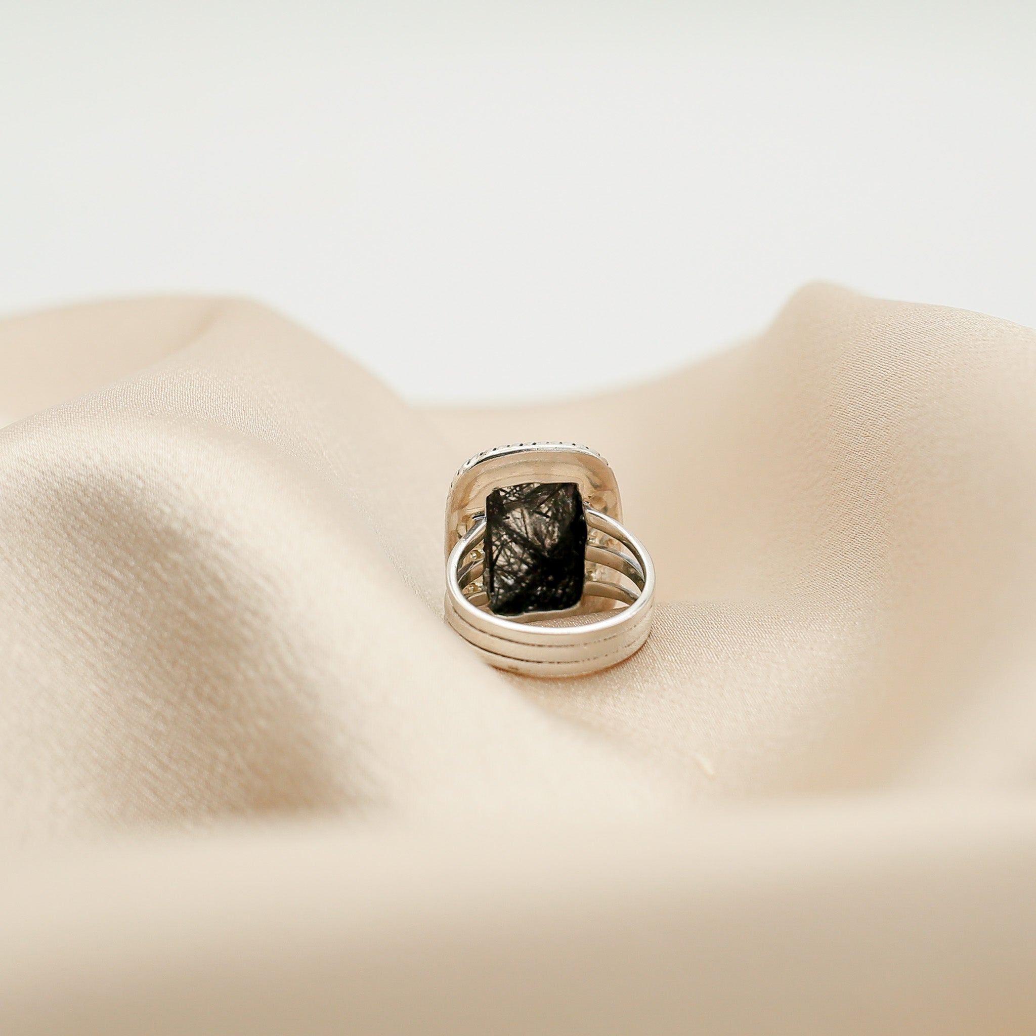 Black tourmaline in clear quartz rectangle ring with open back