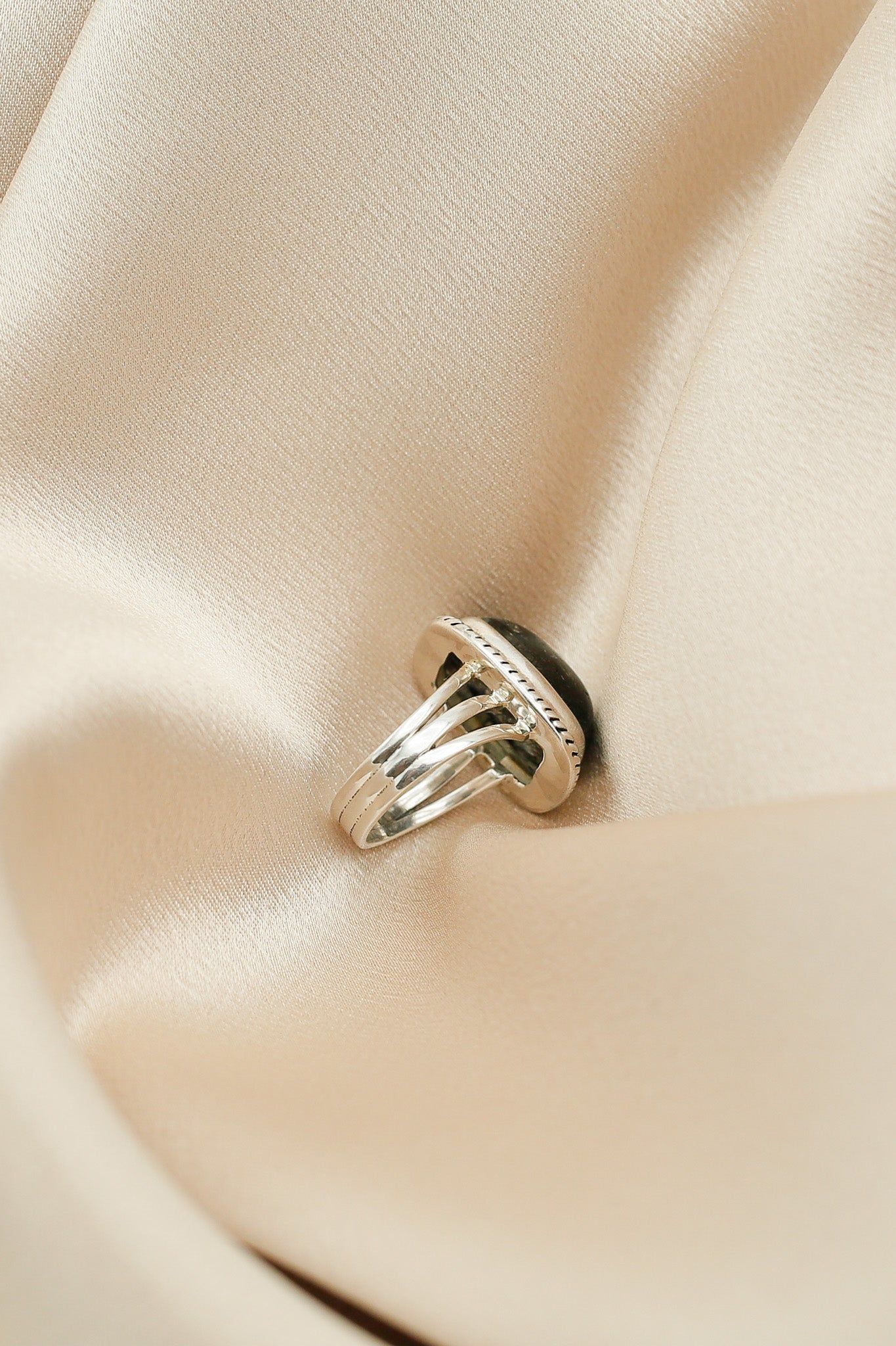 black tourmaline ring with three piece flat wire silver band and twisted wire detail