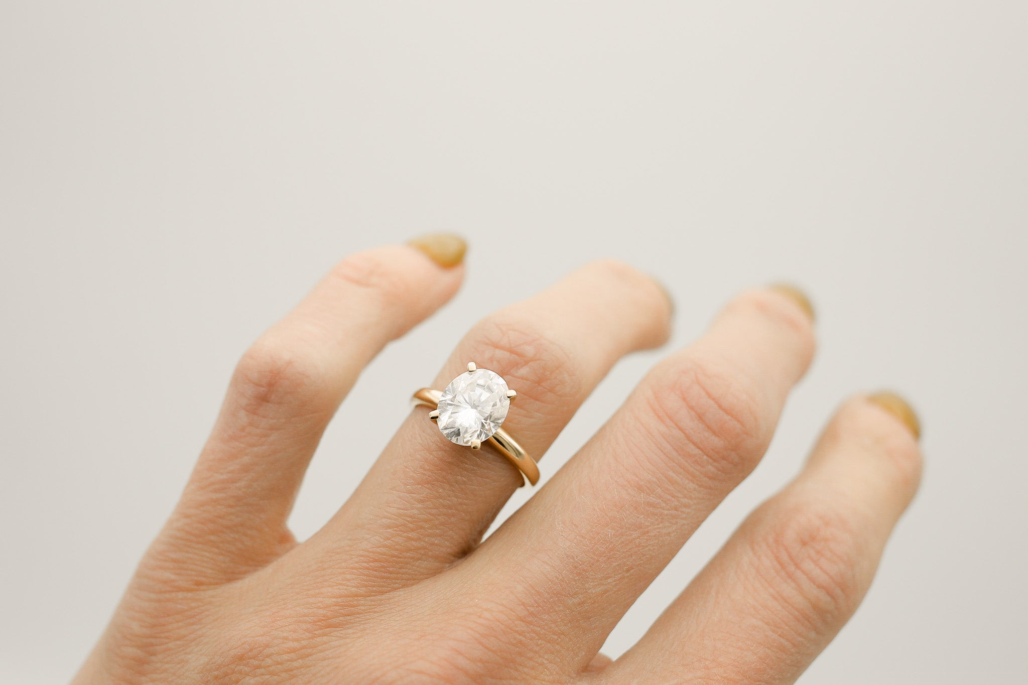 Four prong 3ct oval solitaire engagement ring in yellow gold by Cival Jewelry shop Milwaukee