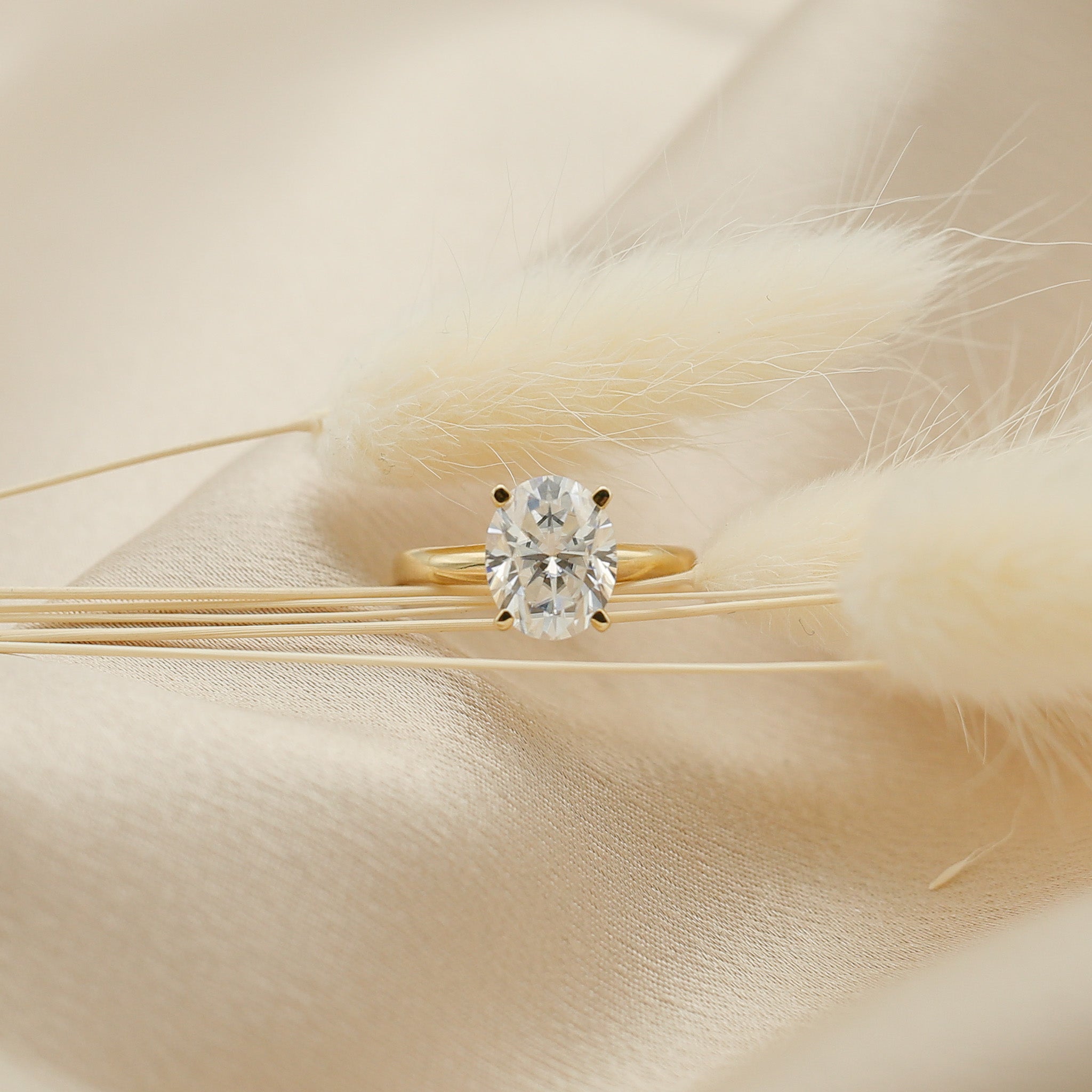 Four prong 3ct oval solitaire engagement ring in yellow gold by Cival Jewelry shop Milwaukee