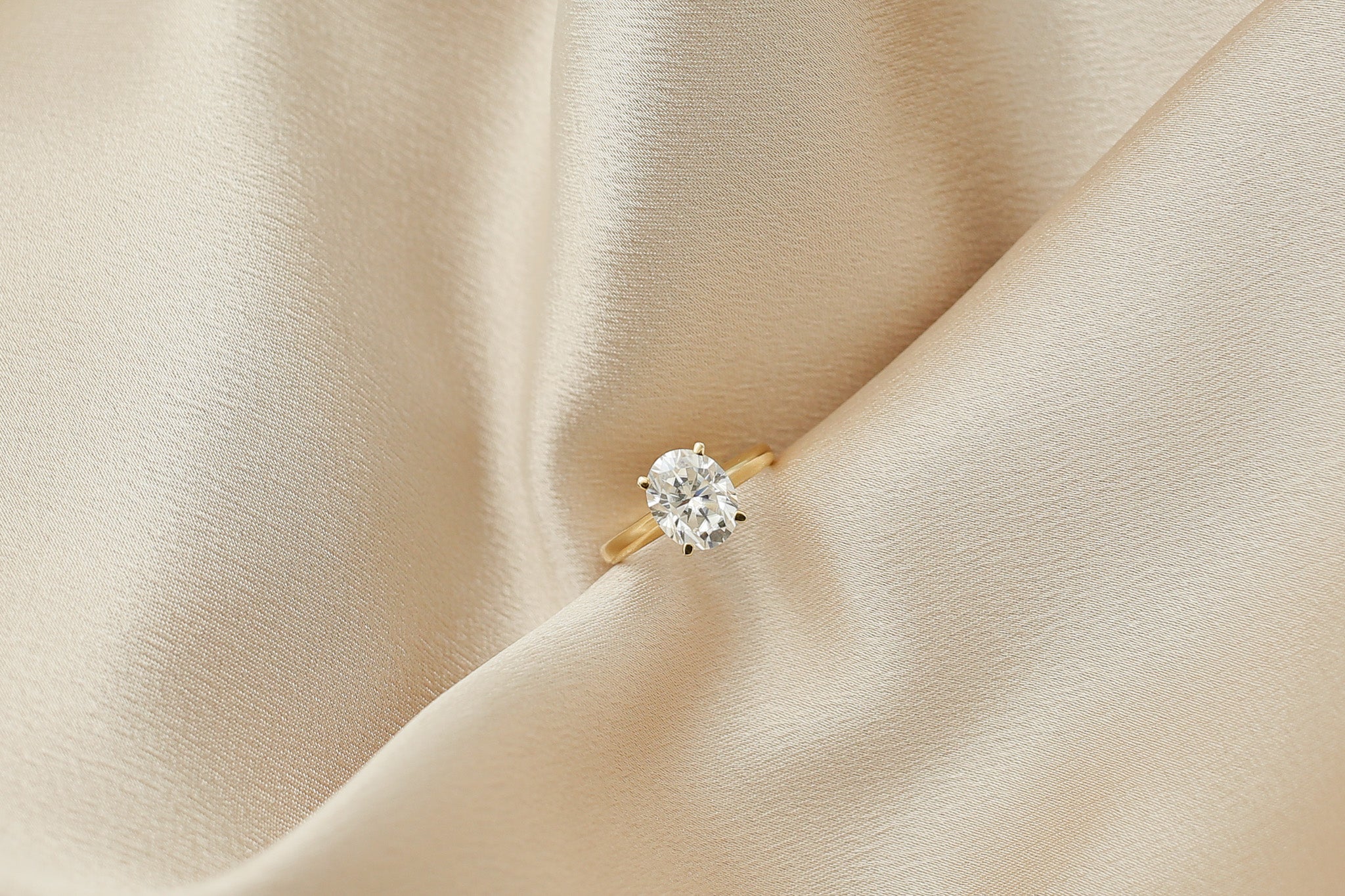 Four prong 3ct oval solitaire engagement ring in yellow gold by Cival Jewelry shop Milwaukee