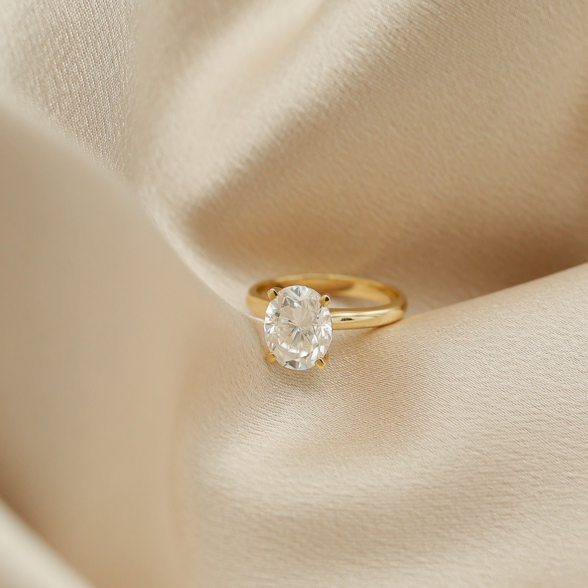 Four prong 3ct oval solitaire engagement ring in yellow gold by Cival Jewelry shop Milwaukee