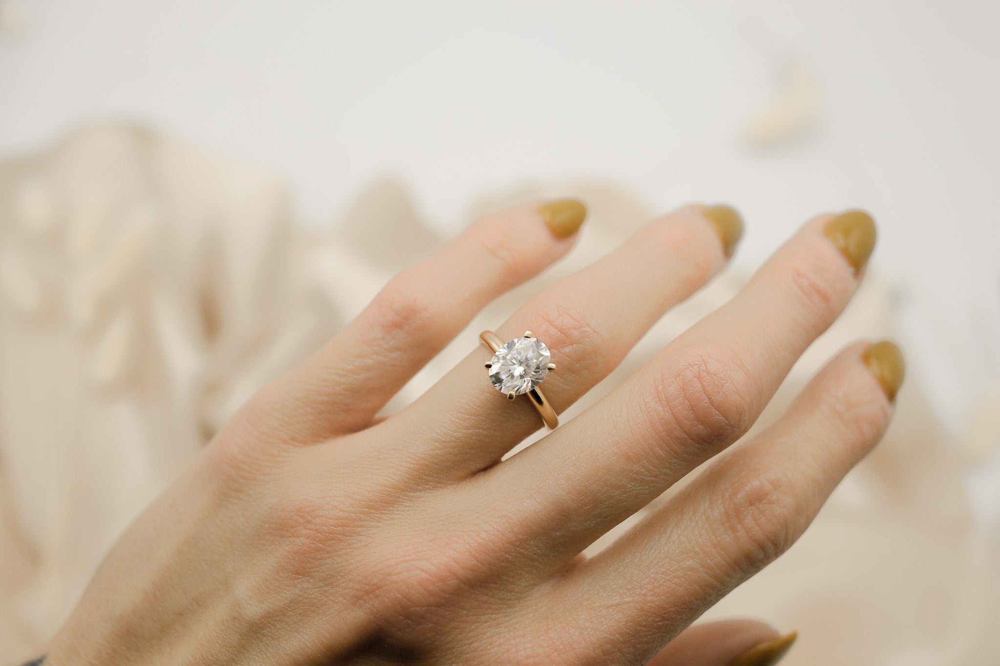 Four prong 3ct oval solitaire engagement ring in yellow gold by Cival Jewelry shop Milwaukee