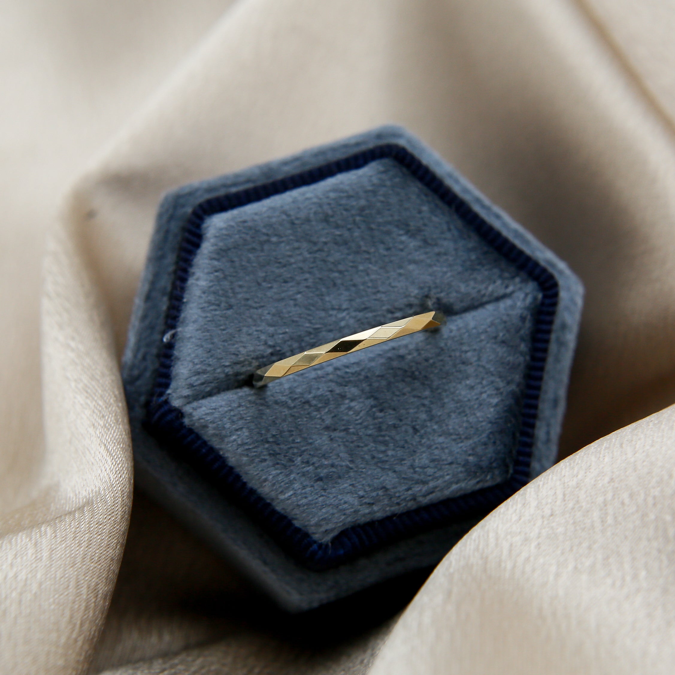 Yellow gold faceted pattern ring by unique Milwaukee Jewelry shop Cival. Fine jewelry designs for anniversary presents, birthday presents or special occasions.