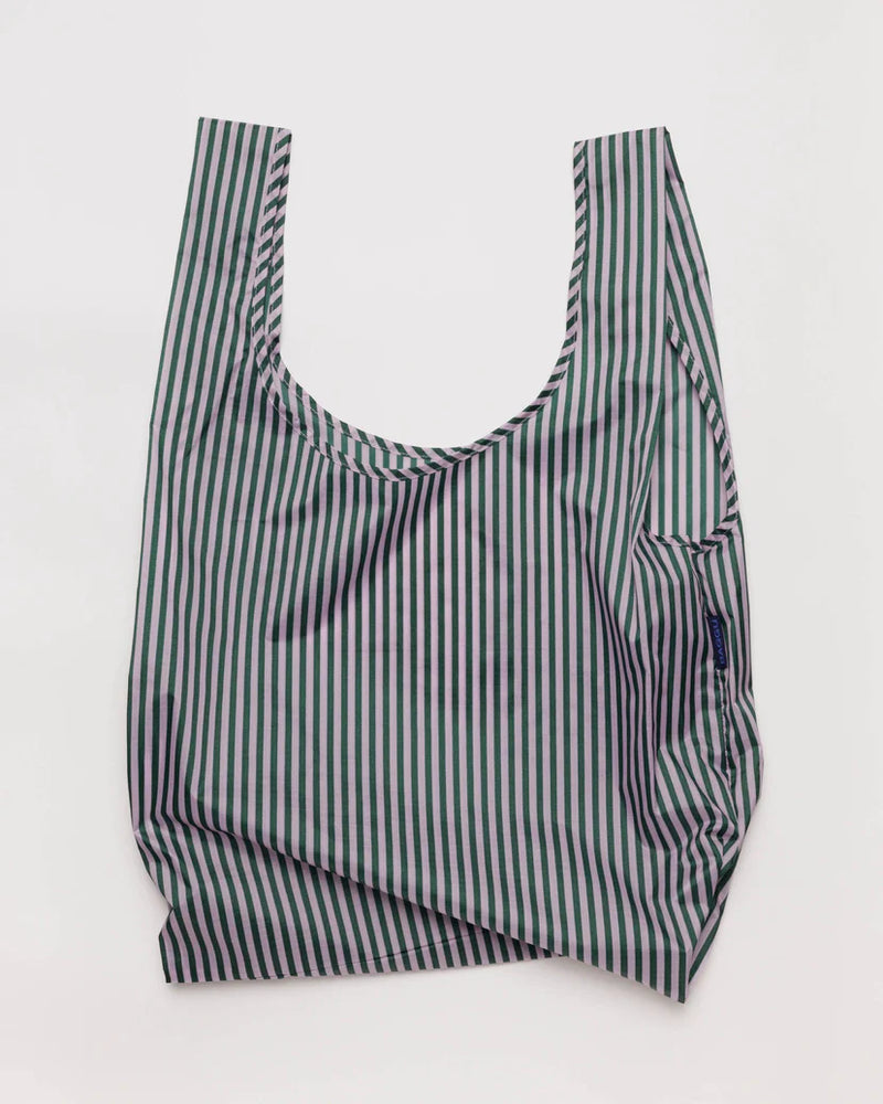 Open baggu standard size reusable bag in the lilac candy stripe print colors are lilac and navy blue