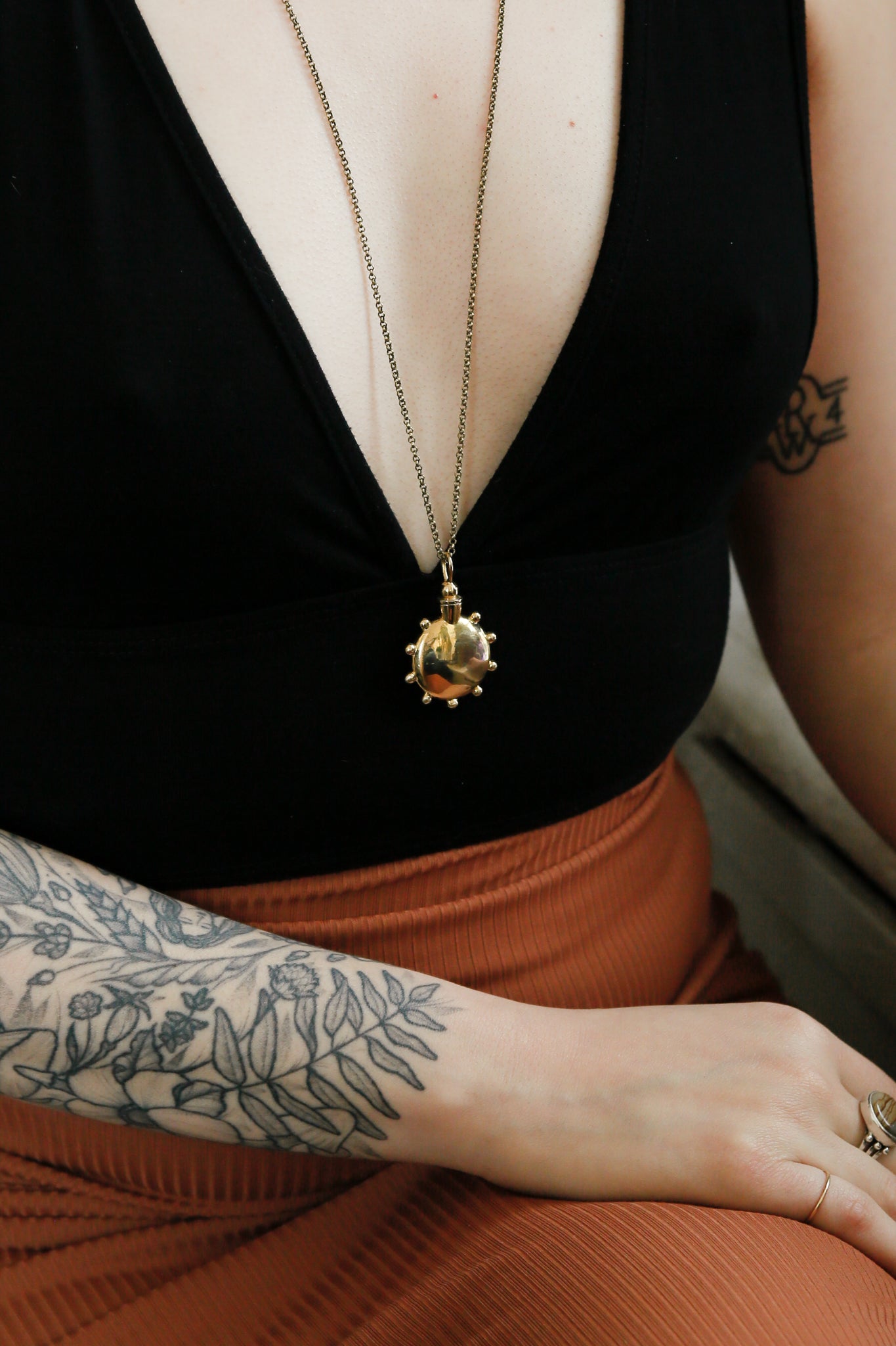 perfume bottle pendant is a container necklace. This engravable desing is a custom made jewelry piece made by local Milwaukee shop Cival Collective