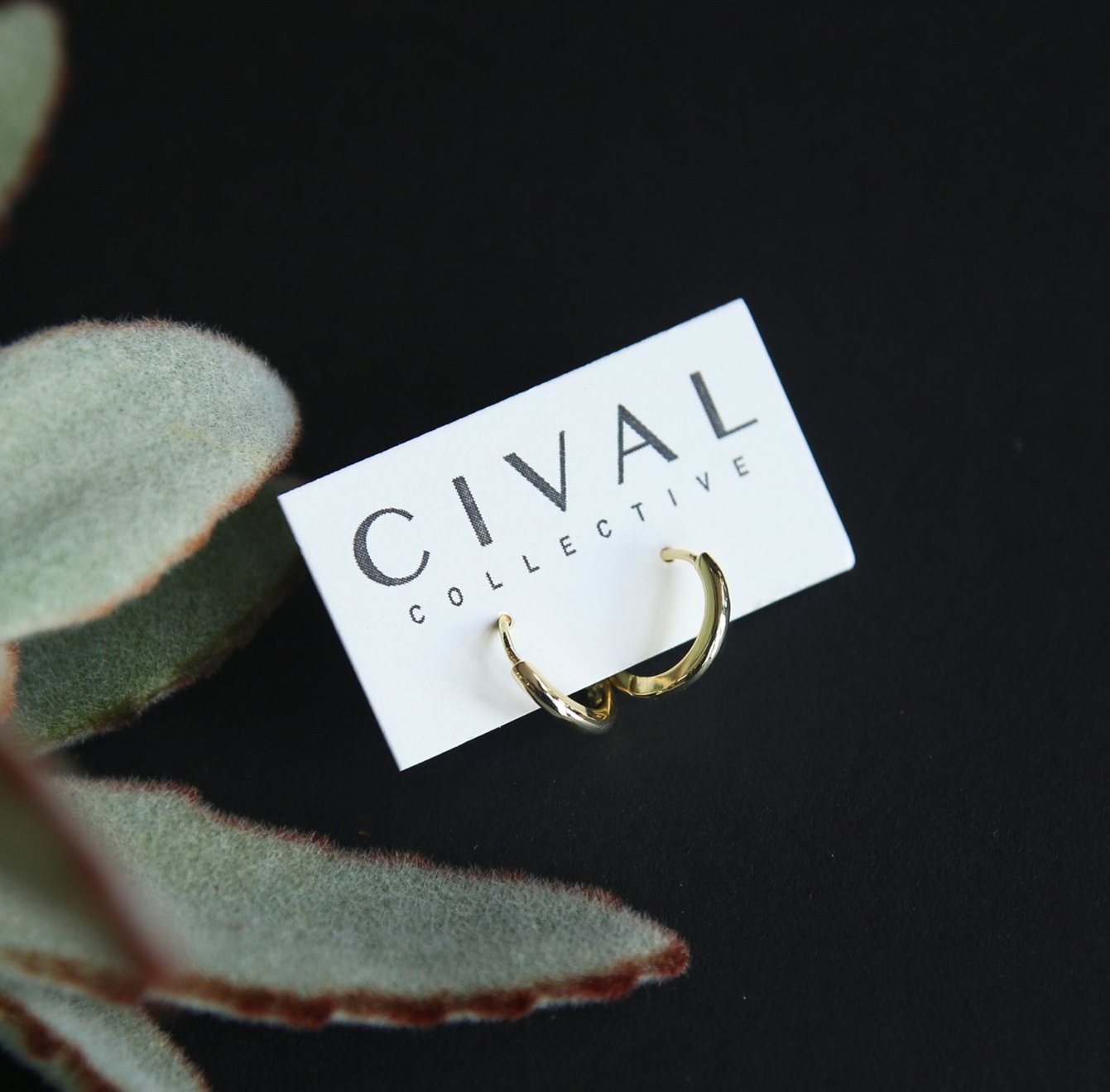 close up of gold fill fatima hoops