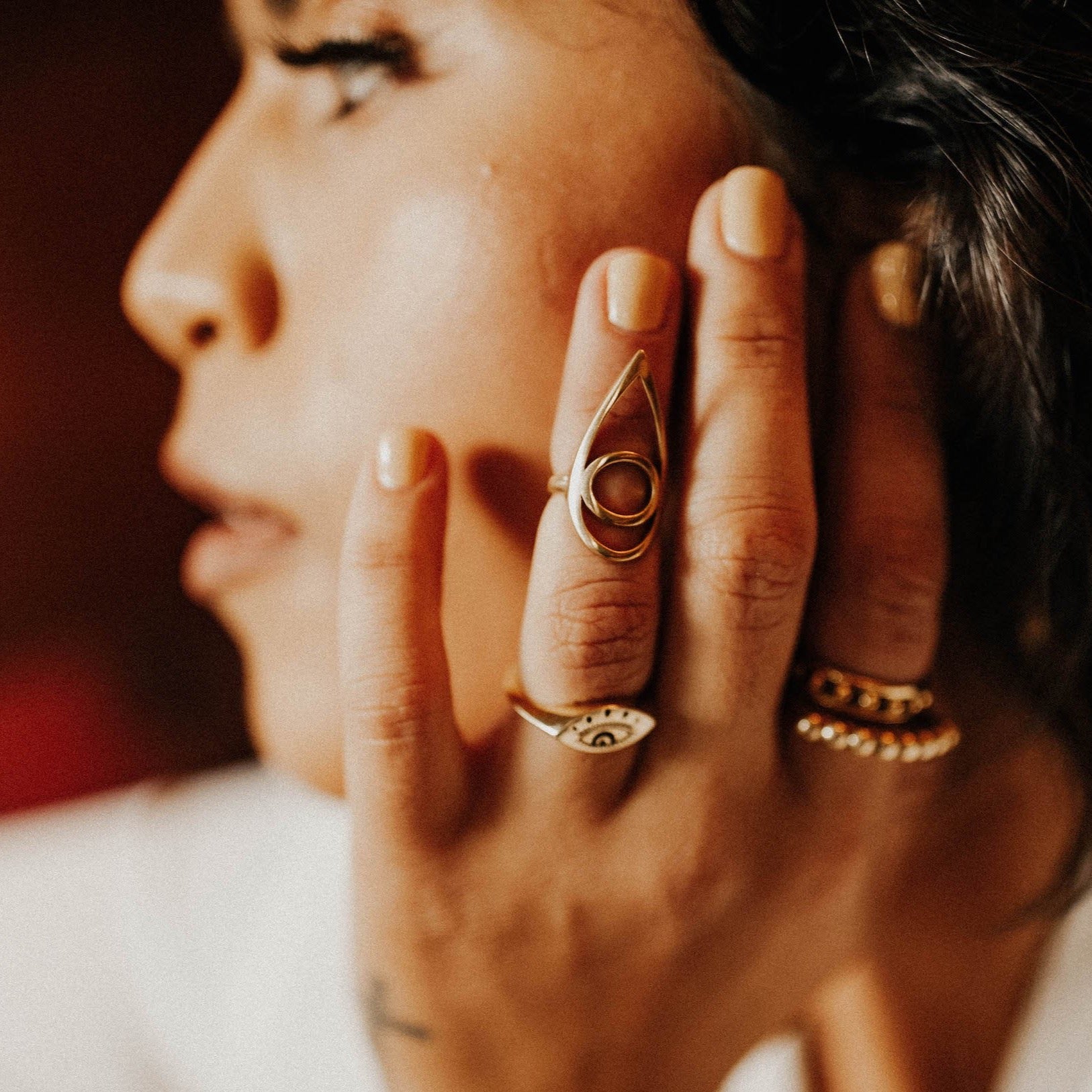 kat midi ring on model, design by cival collective and cast in brass. the perfect bartender accessory