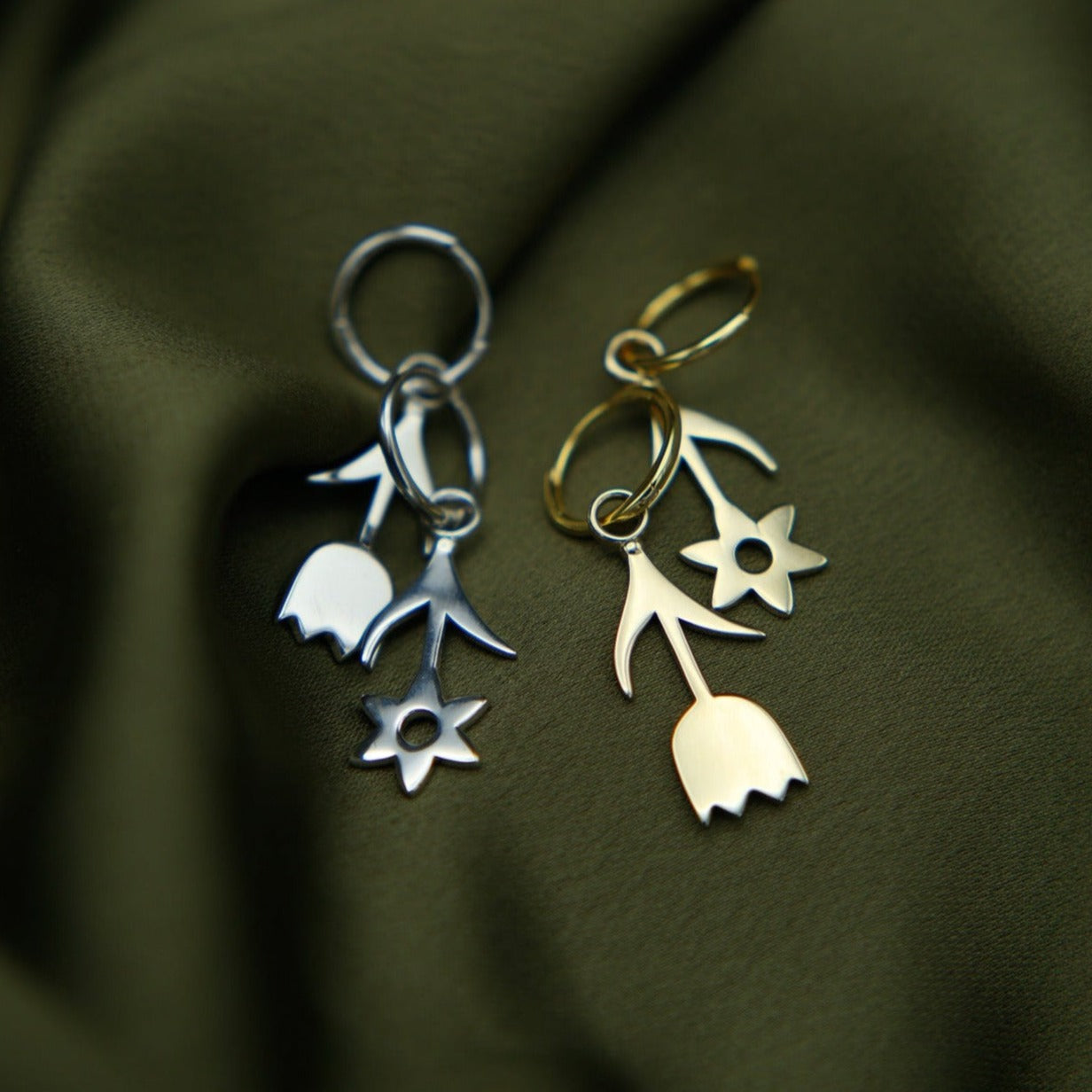 close up of flora/daisy drop hoops in both gold fill and sterling silver.