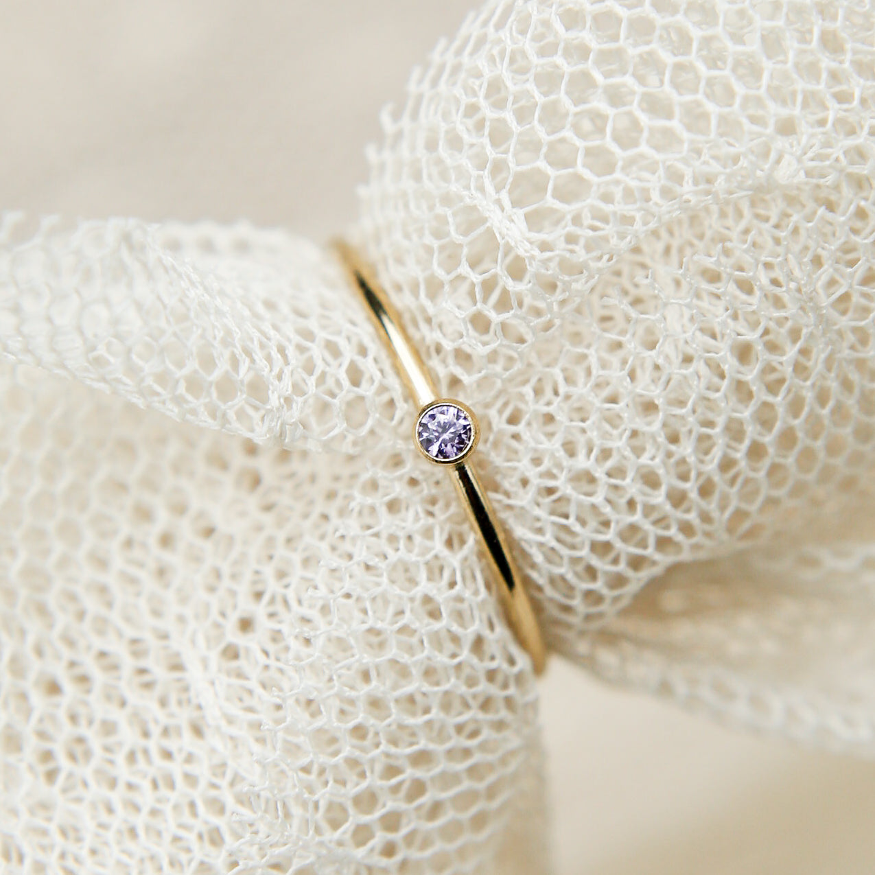 close up photo of gold stacking ring