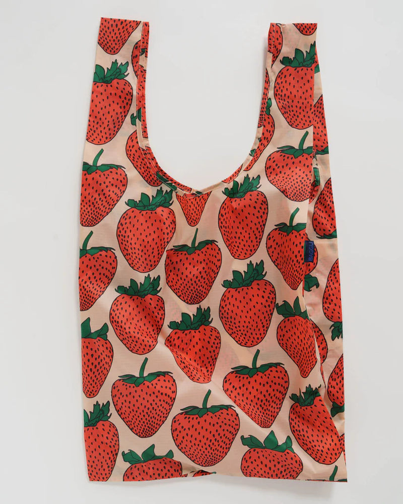 Big baggu designed with red pink and green strawberry pattern open to show full size of reusable bag
