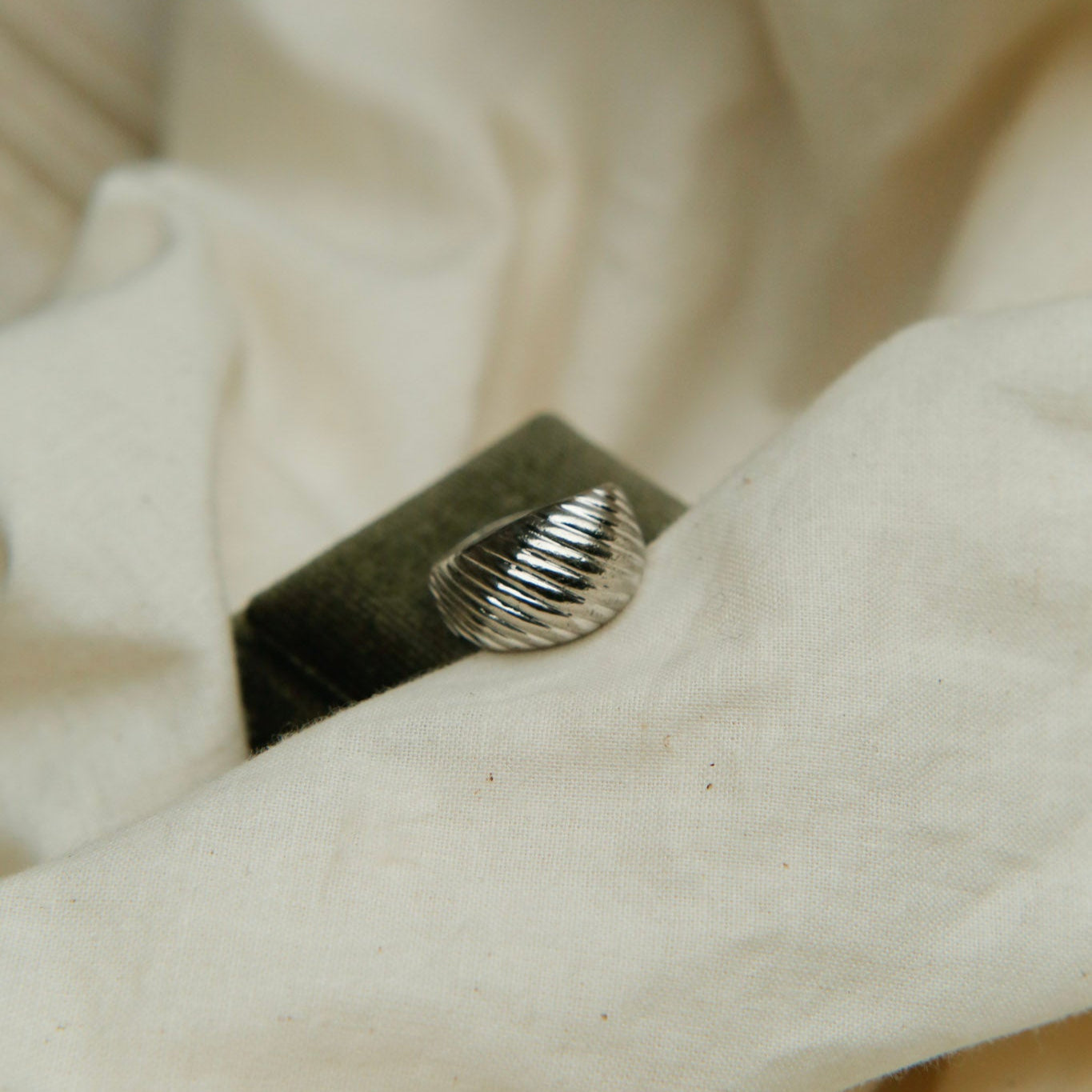 Sterling silver vintage ring with wave pattern on front and tapered band. Sold at cival collective in milwaukee wisconsin