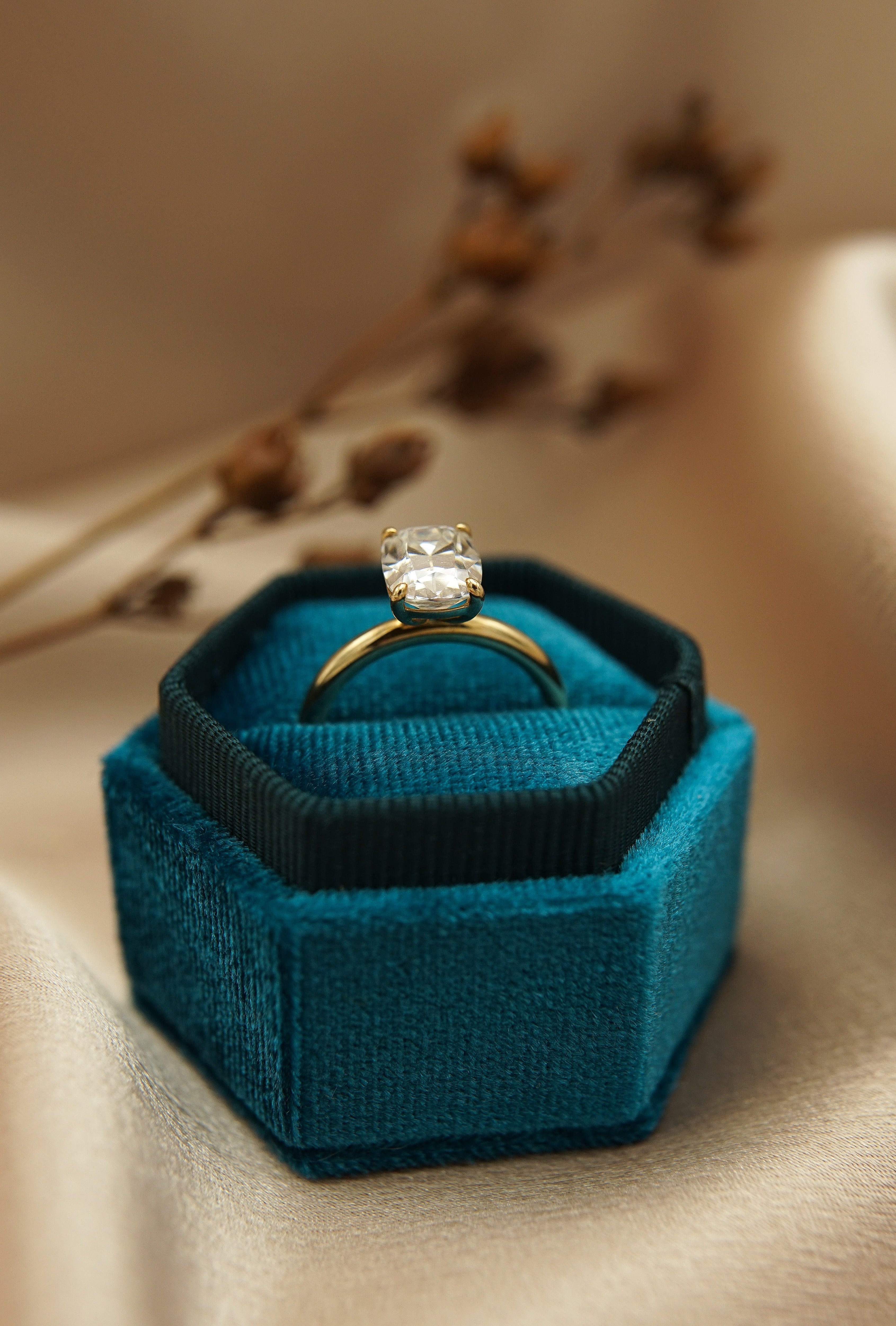 2ct Antique Cushion cut moissanite diamond engagement ring on a yellow gold band, by Unique Milwaukee Jewelry Store Cival Collective. Expertly crafted gold ring stacks with any style wedding band.  