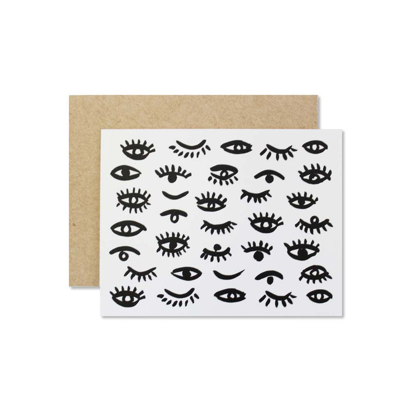 folded blank card with images of hand painted eyes, craft colored envelope 
