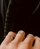 Side profile yellow gold bezel set engagement ring by Cival Collective Retail and Jewelry Shop in Milwaukee WI