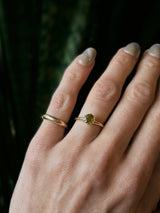 Unique yellow gold antique engagement ring fully restored and reset with a green gemstone by local Milwaukee Jewelry store Cival collective