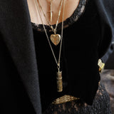 Layering cival collective necklaces - pill case, heart, and sword pendant  Cival Style