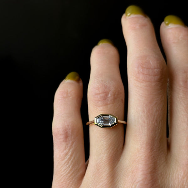 East west emerald cut Moissantie and yellow gold engagement ring by cival collective 