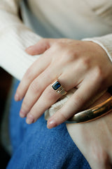 Blue sapphire ring with two rows of natural round diamonds 