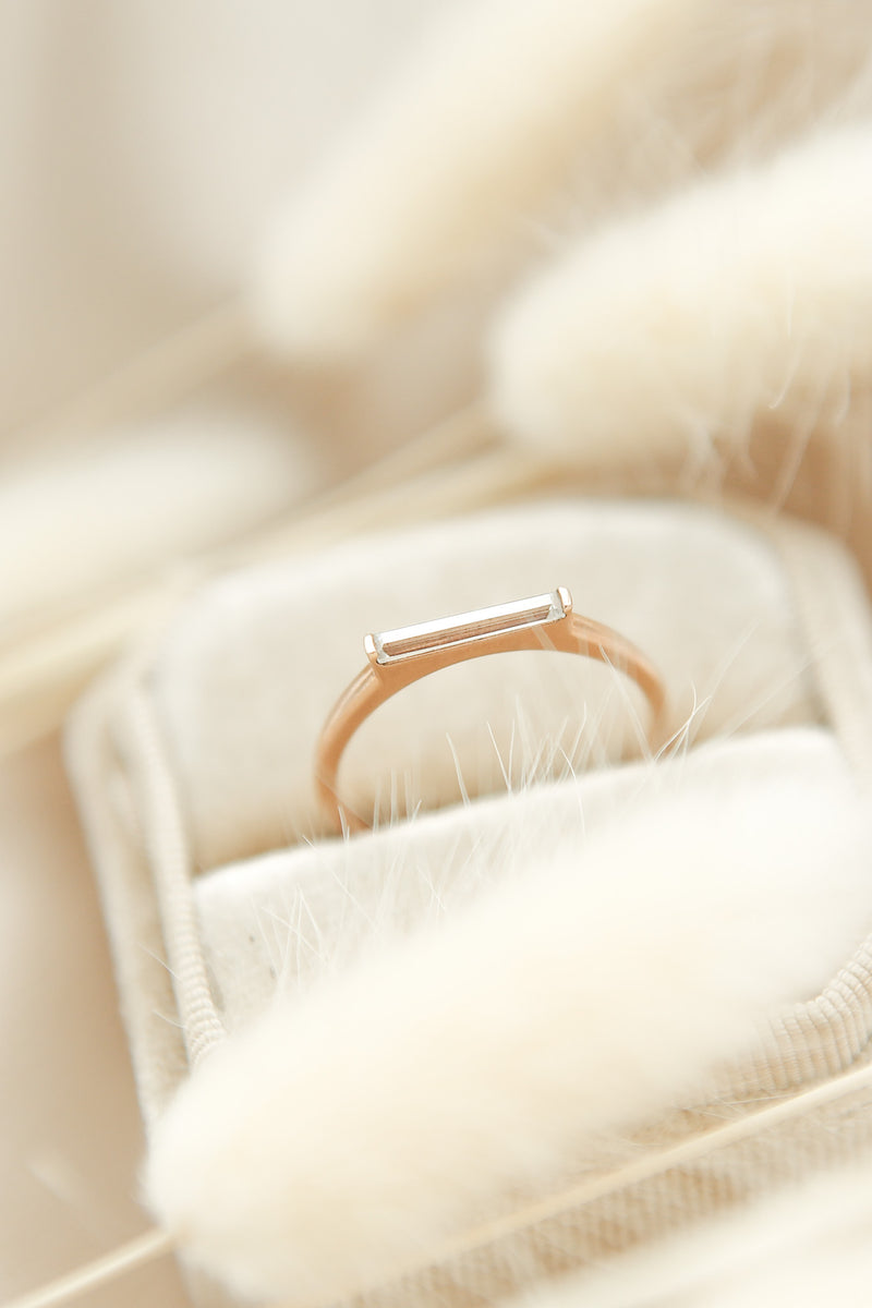 East west set rose gold modern stacking ring with straight bar set moissanite baguette  by local milwaukee jewelry shop Cival 