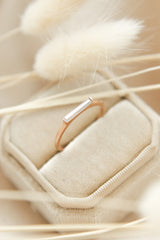 East west set rose gold modern stacking ring with straight bar set moissanite baguette  by local milwaukee jewelry designers Cival Collective
