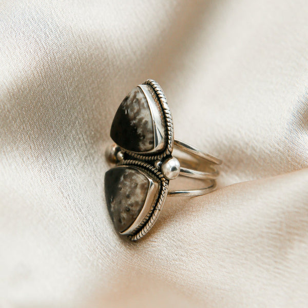 close up of double dinosaur agate ring with twisted sterling silver and bead accents 