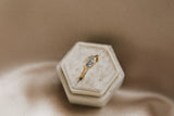 Yellow gold east west step cut gray moissanite engagement ring in vintage velvet box by cival 
