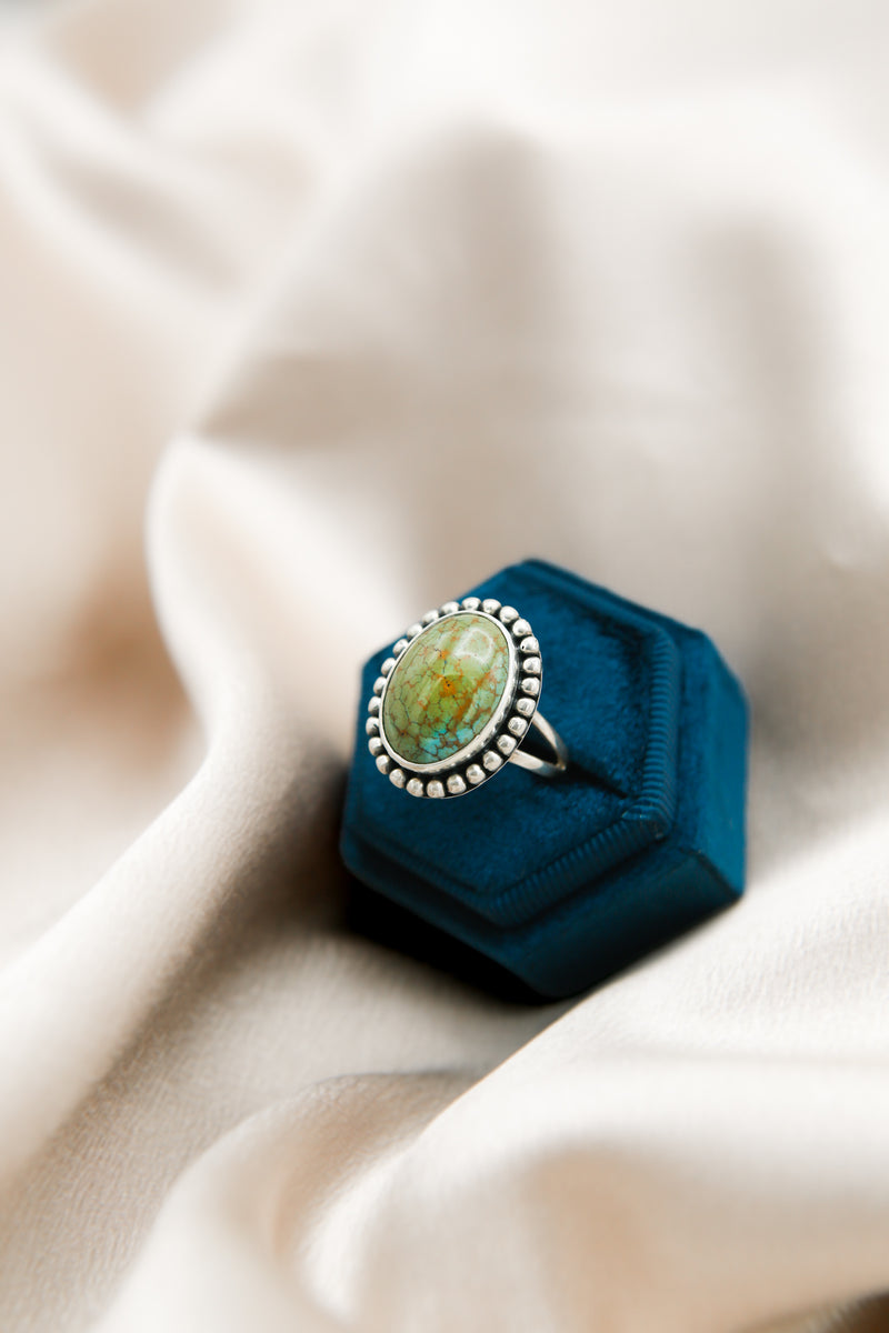 Traditional southwest style silver ring with teal green Royston turquoise 
