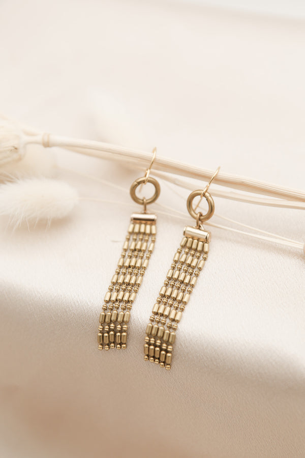 brass beaded tassel fringe earrings by local Milwaukee jewelry shop Cival collective. 