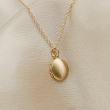 tiny oval shaped locket on gold filled chain - cival collective Jewelry Design company Milwaukee WI