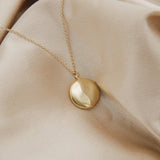 round coin shaped locket on gold filled chain - cival collective Jewelry Design company Milwaukee WI