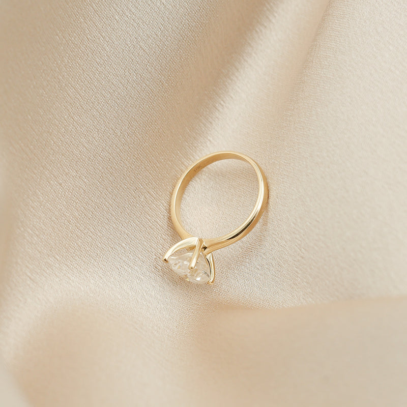 Four prong 3ct oval solitaire engagement ring in yellow gold by Cival Jewelry shop Milwaukee side profile 