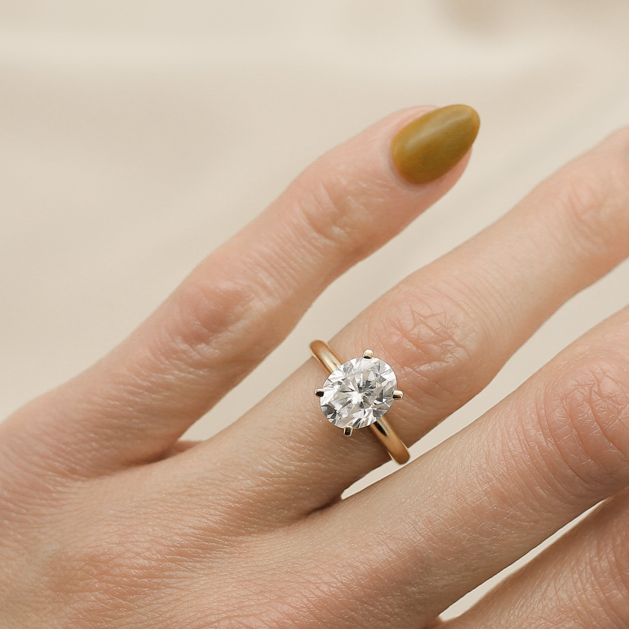 Four prong 3ct oval solitaire engagement ring in yellow gold by Cival Jewelry shop Milwaukee 