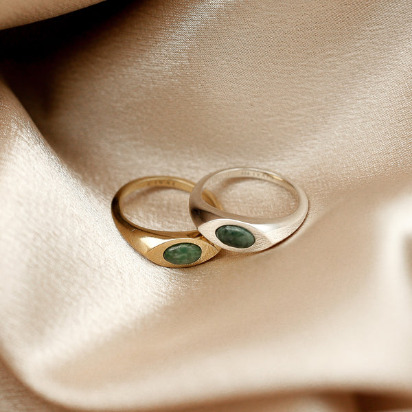 Brass and Sterling Silver signet rings set with an east west marquise cut jade stone. Made in-house by Cival Collective in Milwaukee, WI.