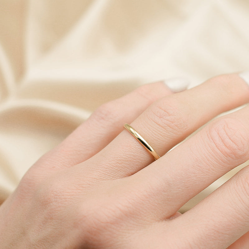 Sleek yellow gold wedding band by unique local jewelry store cival in Milwaukee WI