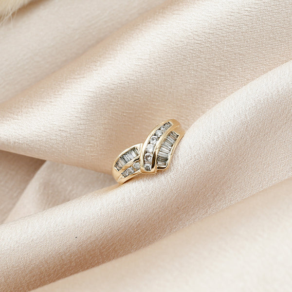 Vintage Natural diamond contoured band with channel set baguettes and round brilliants 