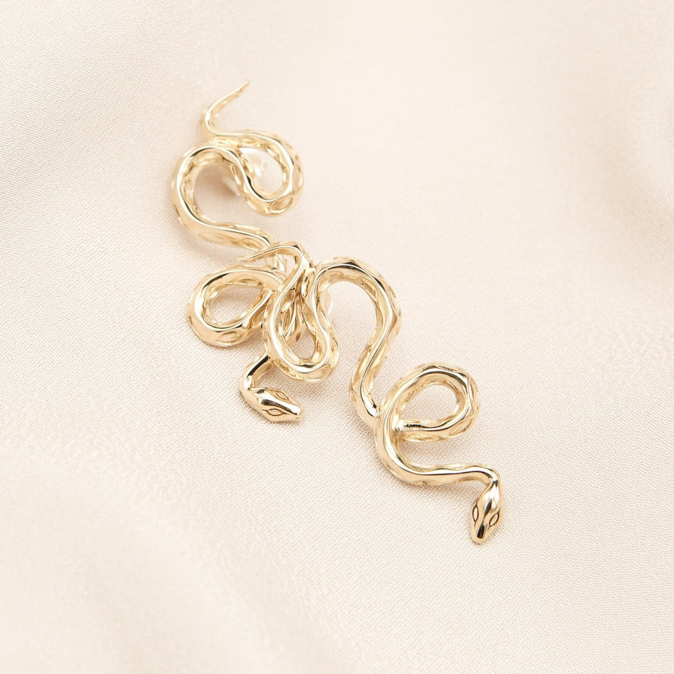 Twisting snake earrings designed by Milwaukee creative jewelry company Cival 