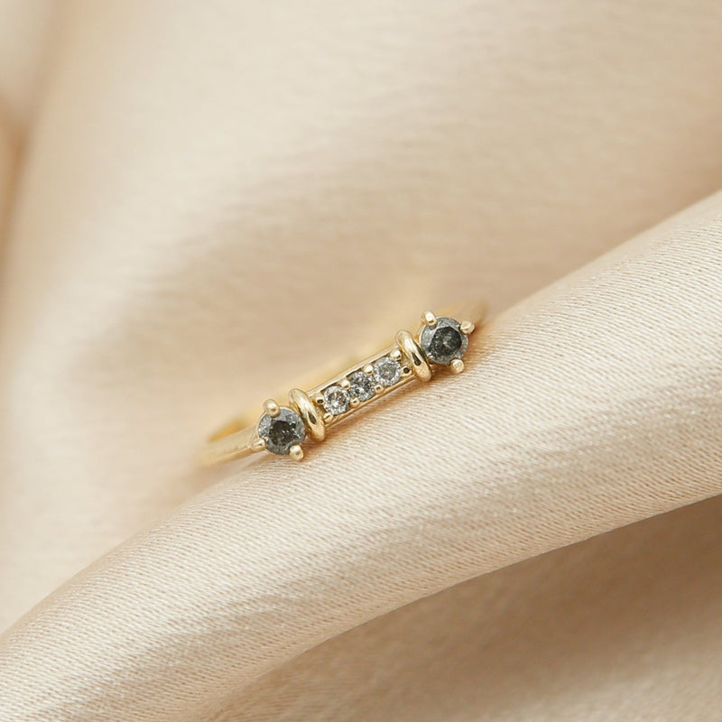 Salt and pepper diamond stacking ring in 14K yellow gold seen at our jewelry store in Milwaukee.