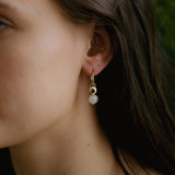 Close up off Claudette hoops with moonstone settings. 20mm gold plated hoops over sterling