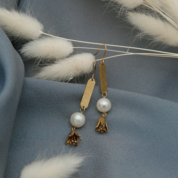 Pearl earrings with textured brass and flower drops 