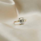 an emerald cut moissanite engagement ring 