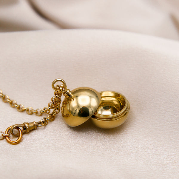 close up of Enzo necklace, open container necklace, cast brass designed in house by Cival Collective